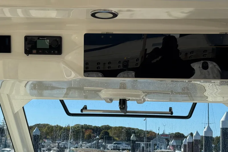 Slide: The Image of Interior view of 2020 Boston Whaler 420 Outrage boat with electronic controls. - 39
