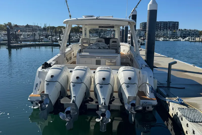 Slide: The Image of 2020 Boston Whaler 420 Outrage docked with four powerful outboard engines. - 6