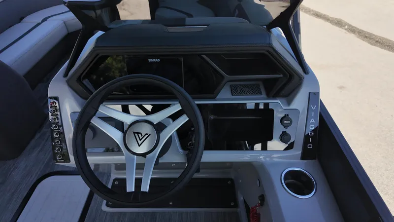 Slide: The Image of 2025 Viaggio X22S boat dashboard with modern steering wheel and control panel. - 13