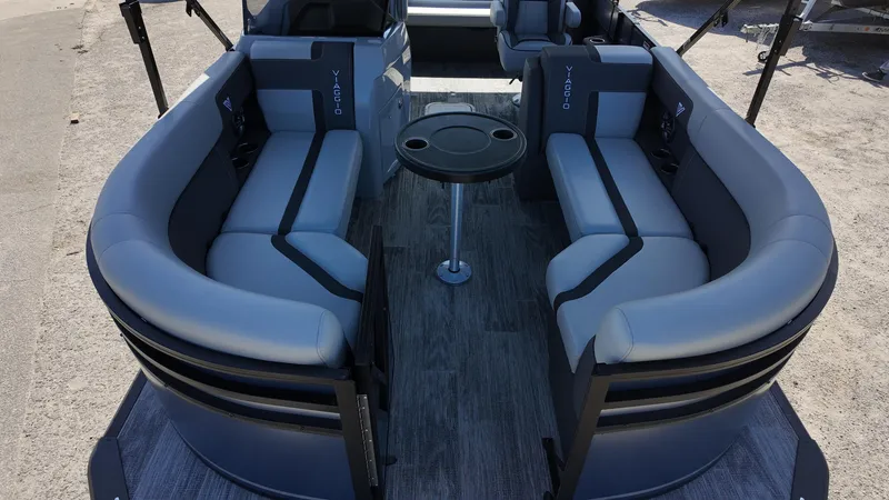 Slide: The Image of Luxurious 2025 Viaggio X22S boat interior with sleek gray seating and central table. - 16