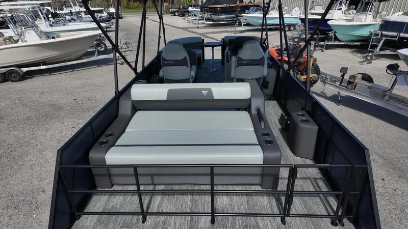 Slide: The Image of 2025 Viaggio X22S pontoon boat with spacious seating and modern design at a marina. - 7