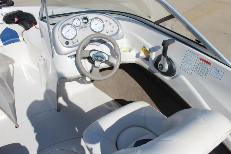 Slide: The Image of 2008 Tahoe Q5i SF boat interior with steering wheel and control panel. - 11