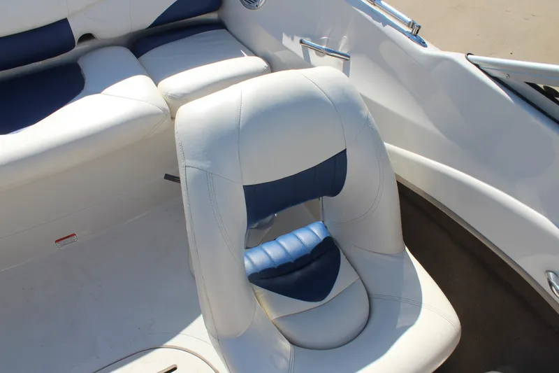 Slide: The Image of 2008 Tahoe Q5i SF boat interior with white and blue seating. - 15