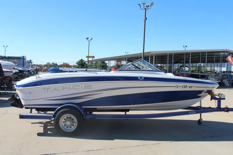 Slide: The Image of 2008 Tahoe Q5i SF boat on trailer in outdoor dealership lot. - 3