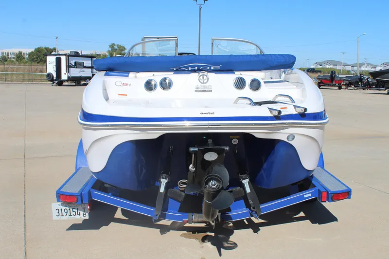 Slide: The Image of 2008 Tahoe Q5i SF boat on trailer, rear view, blue and white design. - 5