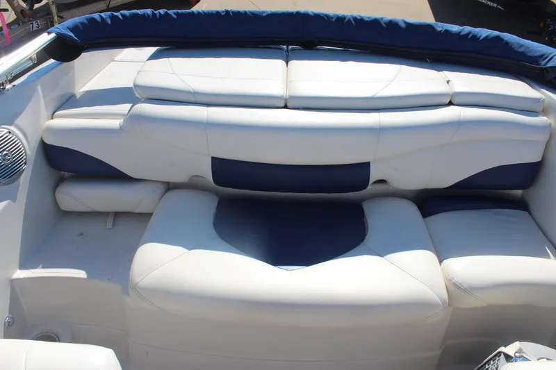 Slide: The Image of 2008 Tahoe Q5i SF boat interior with white and blue cushioned seating. - 8