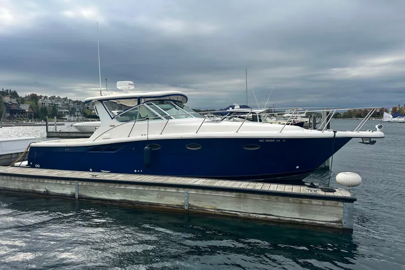 The Image of 2004 Tiara Yachts 3500 Open docked at a marina under cloudy skies. - 0
