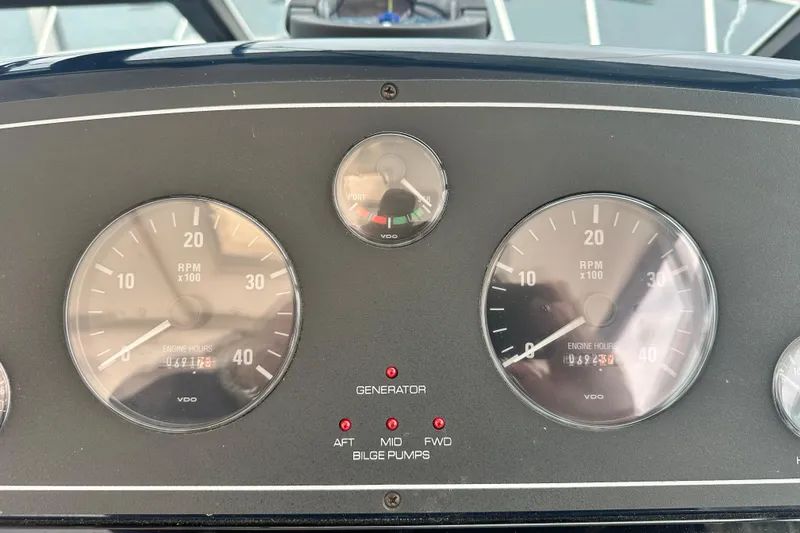 Slide: The Image of Dashboard of a 2004 Tiara Yachts 3500 Open, showing RPM gauges and engine hours. - 15