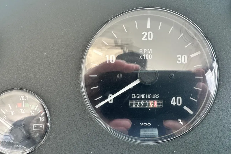 Slide: The Image of Close-up of Tiara Yachts 3500 Open 2004 dashboard gauges showing RPM and engine hours. - 16