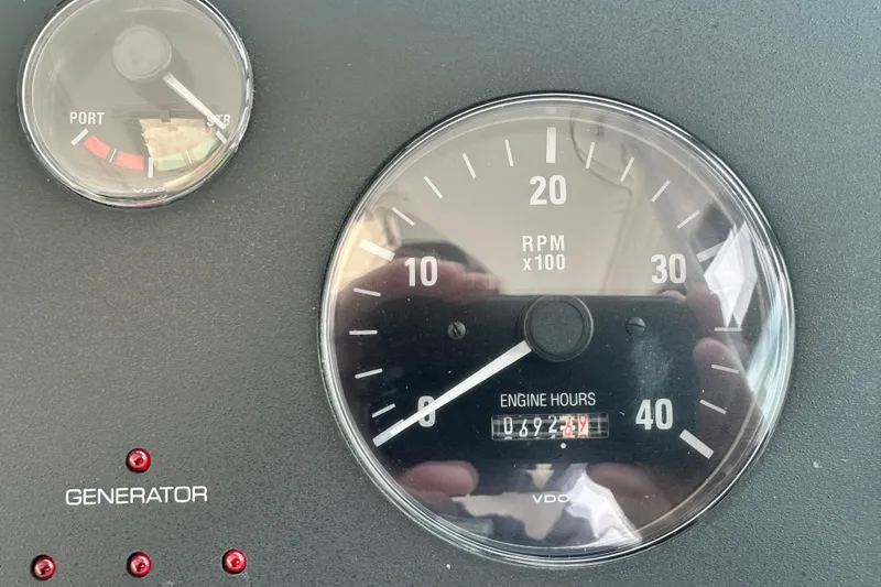 Slide: The Image of Close-up of 2004 Tiara Yachts 3500 Open engine gauges displaying RPM and engine hours. - 17