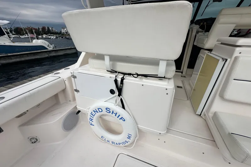 Slide: The Image of 2004 Tiara Yachts 3500 Open interior with life ring, docked at marina. - 9