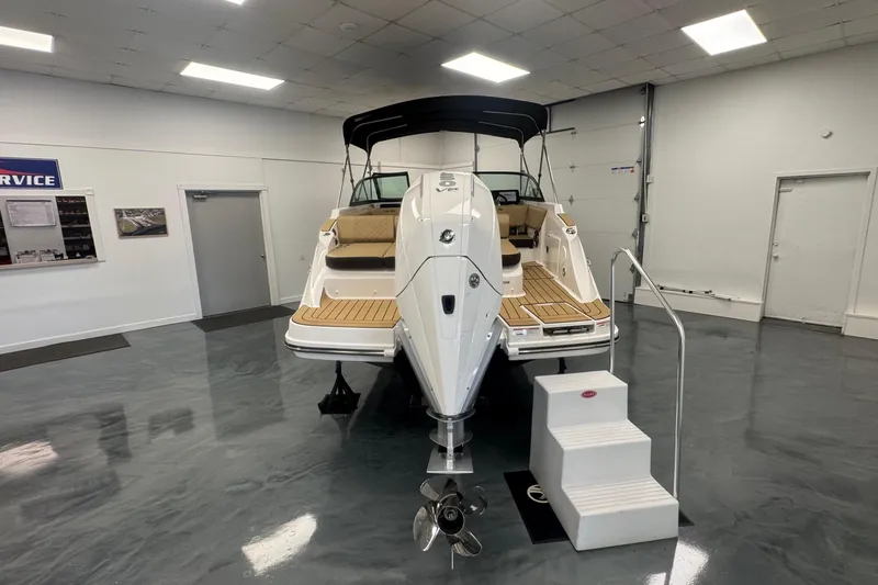 Slide: The Image of 2026 Sea Ray SDX 230 Outboard displayed indoors, showcasing sleek design and modern features. - 4