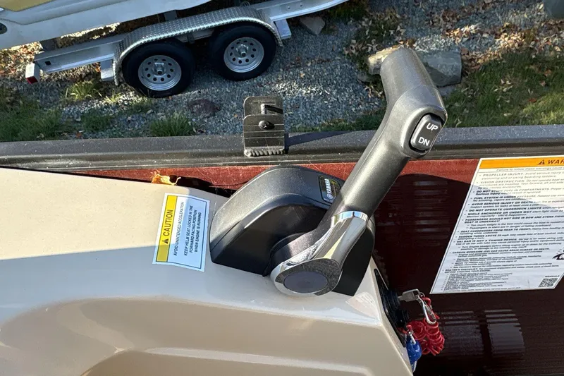 Slide: The Image of Throttle control of 2020 Godfrey Marine 22 boat with caution labels visible. - 11