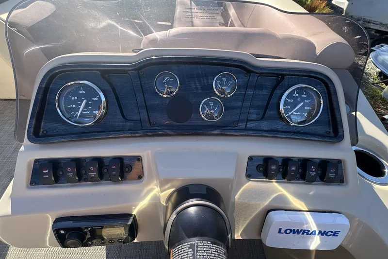 Slide: The Image of Dashboard of a 2020 Godfrey Marine 22 boat with gauges and Lowrance equipment. - 12