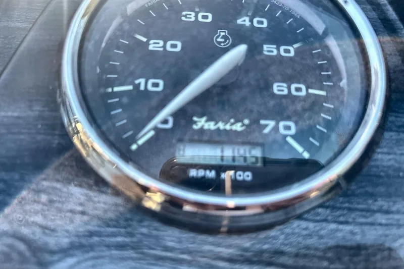 Slide: The Image of Close-up of a Faria tachometer on a 2020 Godfrey Marine 22 boat. - 17