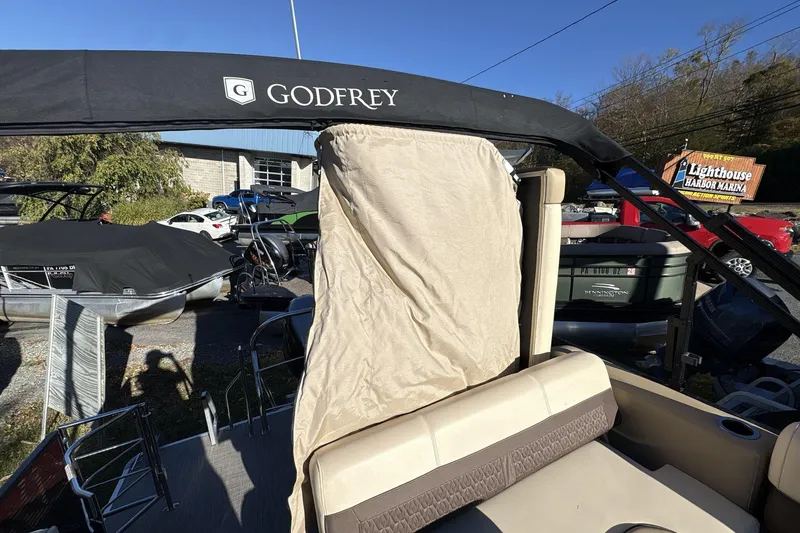Slide: The Image of 2020 Godfrey Marine 22 boat with canopy at Lighthouse Harbor Marina. - 18