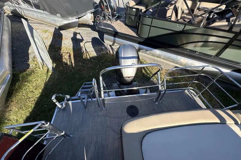 Slide: The Image of 2020 Godfrey Marine 22 pontoon boat with outboard motor and deck railing. - 3