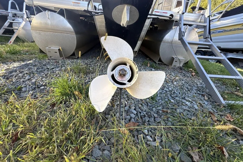 Slide: The Image of Propeller of a 2020 Godfrey Marine 22 boat on gravel and grass. - 5