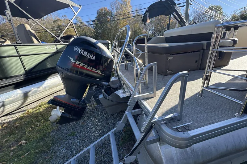 Slide: The Image of 2020 Godfrey Marine 22 pontoon boat with Yamaha outboard motor, docked outdoors. - 6