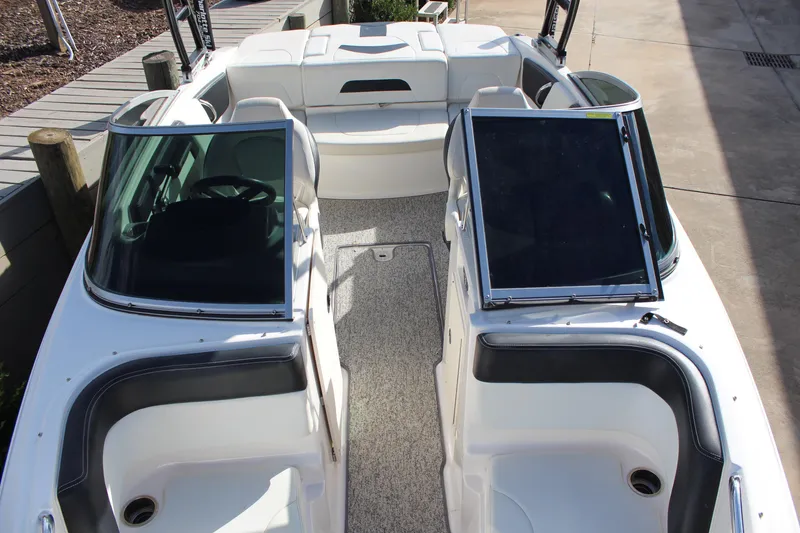 Slide: The Image of 2018 Chaparral 21 H2O Sport boat interior with seating and steering wheel. - 10