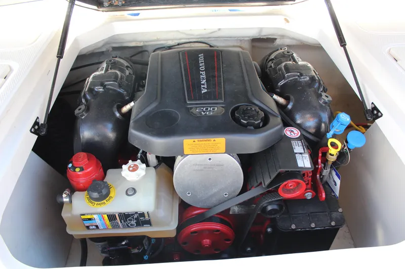 Slide: The Image of 2018 Chaparral 21 H2O Sport engine compartment with Volvo Penta V6 engine. - 11