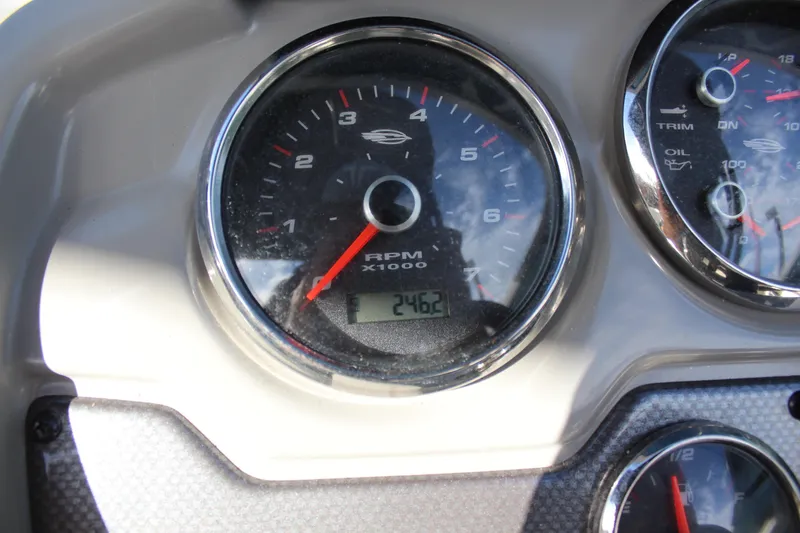 Slide: The Image of Close-up of 2018 Chaparral 21 H2O Sport boat dashboard gauges. - 13