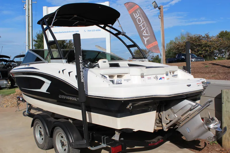 Slide: The Image of 2018 Chaparral 21 H2O Sport boat on trailer, displayed outdoors. - 7