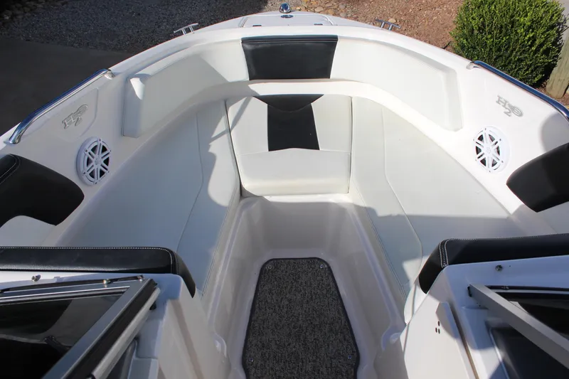 Slide: The Image of 2018 Chaparral 21 H2O Sport boat interior with seating and speakers. - 9
