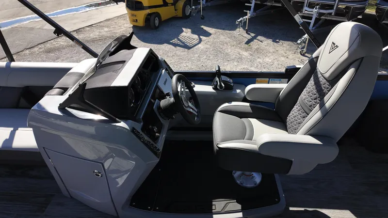 Slide: The Image of Captain's seat and helm of 2025 Viaggio Z24Q boat, featuring modern controls and comfortable seating. - 13