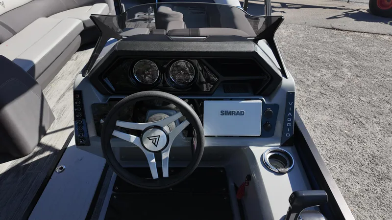 Slide: The Image of Steering console of 2025 Viaggio Z24Q boat with modern controls and Simrad display. - 14