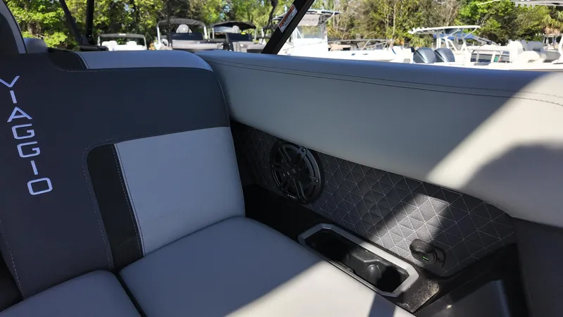 Slide: The Image of Interior of 2025 Viaggio Z24Q boat with stylish seating and speaker detail. - 15