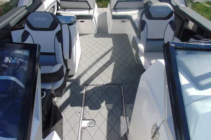 Slide: The Image of 2019 Yamaha Boats 275SD interior with sleek seating and modern design. - 14