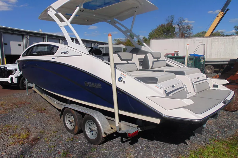 Slide: The Image of 2019 Yamaha Boats 275SD on trailer, featuring sleek design and spacious seating. - 3