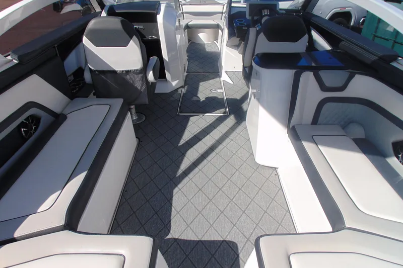 Slide: The Image of 2019 Yamaha Boats 275SD interior with modern seating and sleek design. - 7