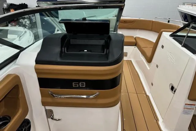 Slide: The Image of 2026 Chaparral 250 OSX boat interior with compact bathroom and toilet. - 10