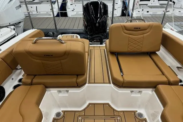 Slide: The Image of 2026 Chaparral 250 OSX boat interior with tan leather seating and modern design. - 14