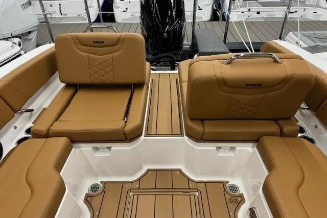 Slide: The Image of 2026 Chaparral 250 OSX boat interior with tan leather seating and modern design. - 15