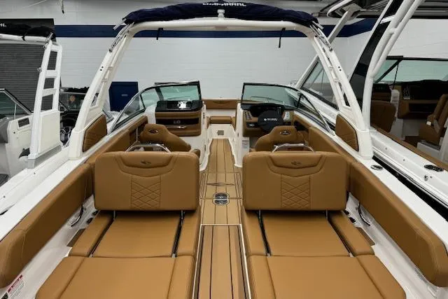 Slide: The Image of 2026 Chaparral 250 OSX boat interior with tan leather seating and modern dashboard. - 23
