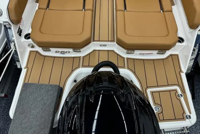 Slide: The Image of 2026 Chaparral 250 OSX boat interior with tan leather seating and modern design. - 24