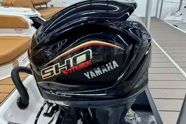 Slide: The Image of 2026 Chaparral 250 OSX boat deck with tan seating and flooring. - 27