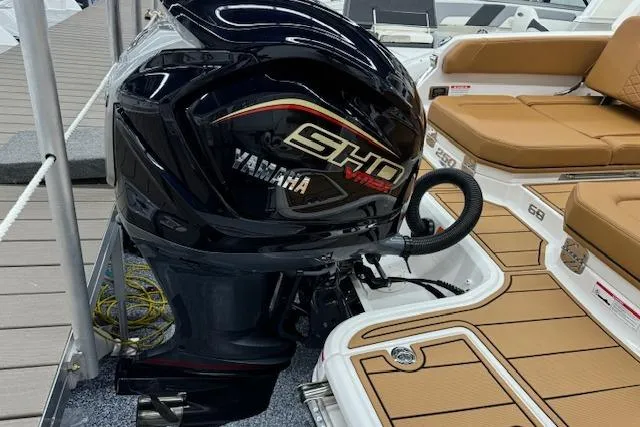 Slide: The Image of 2026 Chaparral 250 OSX boat with Yamaha SHO outboard motor in showroom. - 28
