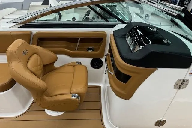 Slide: The Image of Steering console of 2026 Chaparral 250 OSX boat with dual Simrad displays. - 7