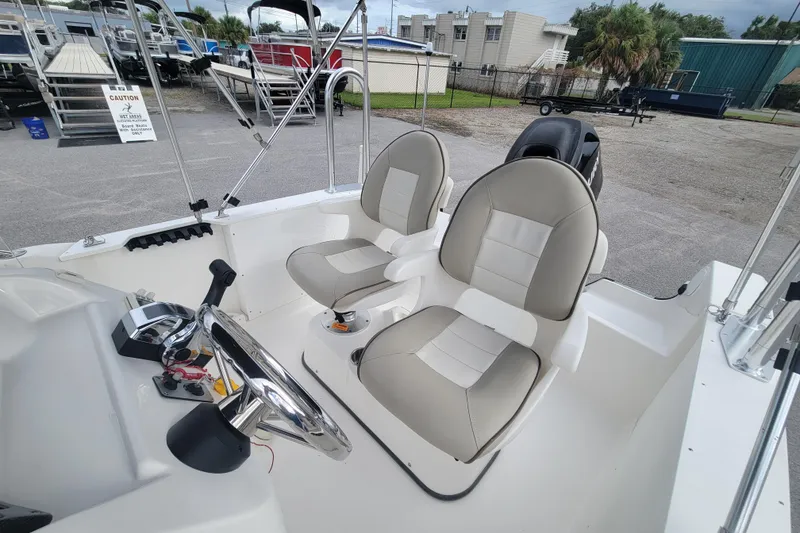 Slide: The Image of 2012 Campion Explorer 492 Center Console boat interior with dual seats and steering wheel. - 11