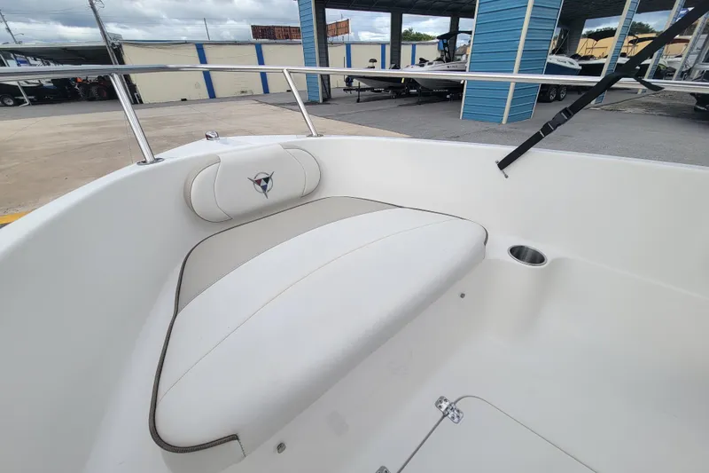 Slide: The Image of 2012 Campion Explorer 492 Center Console boat interior with cushioned seating and cup holder. - 14