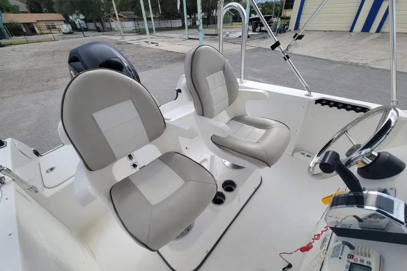 Slide: The Image of 2012 Campion Explorer 492 Center Console boat interior with dual seats and steering wheel. - 17