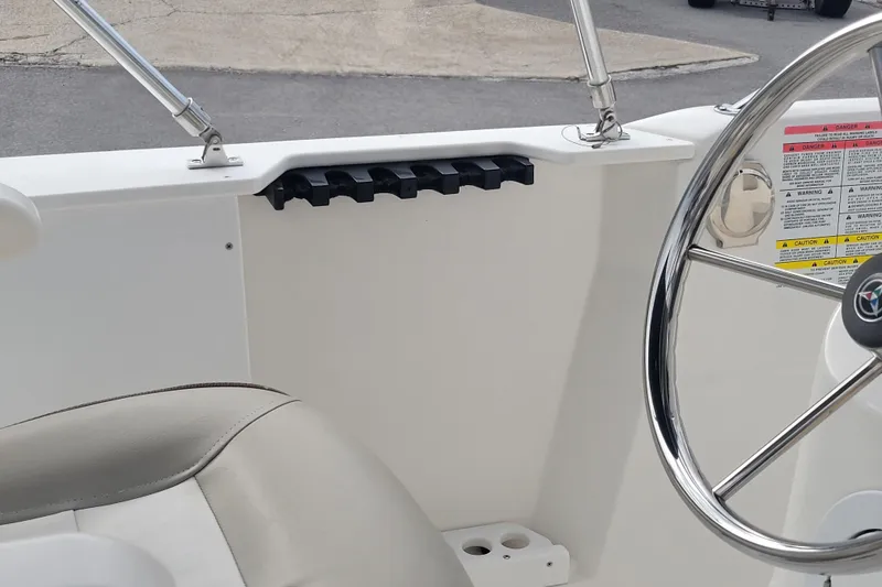 Slide: The Image of 2012 Campion Explorer 492 Center Console interior with steering wheel and seat detail. - 18