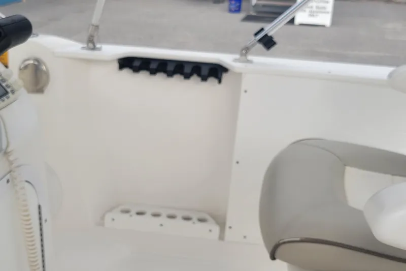 Slide: The Image of 2012 Campion Explorer 492 Center Console interior with seating and storage compartments. - 21