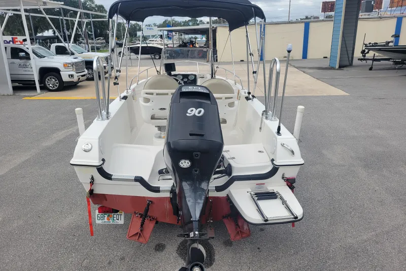 Slide: The Image of 2012 Campion Explorer 492 Center Console boat with 90 HP engine, parked outdoors. - 5