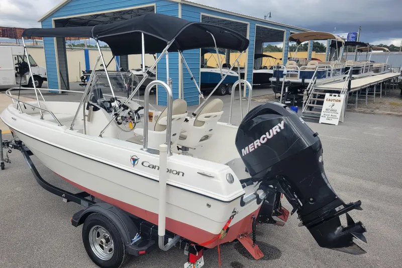 Slide: The Image of 2012 Campion Explorer 492 Center Console boat with Mercury engine, parked outdoors. - 6