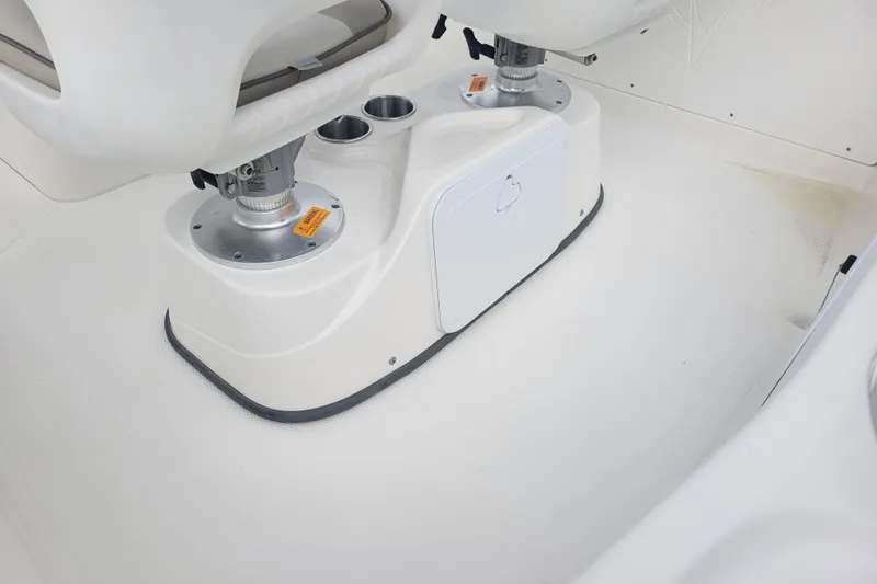 Slide: The Image of 2012 Campion Explorer 492 Center Console interior with dual pedestal seats and storage compartment. - 8